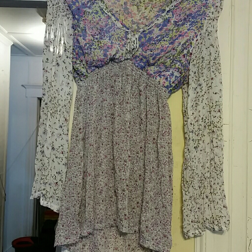 Pretty long sleeve top with purple floral pattern.